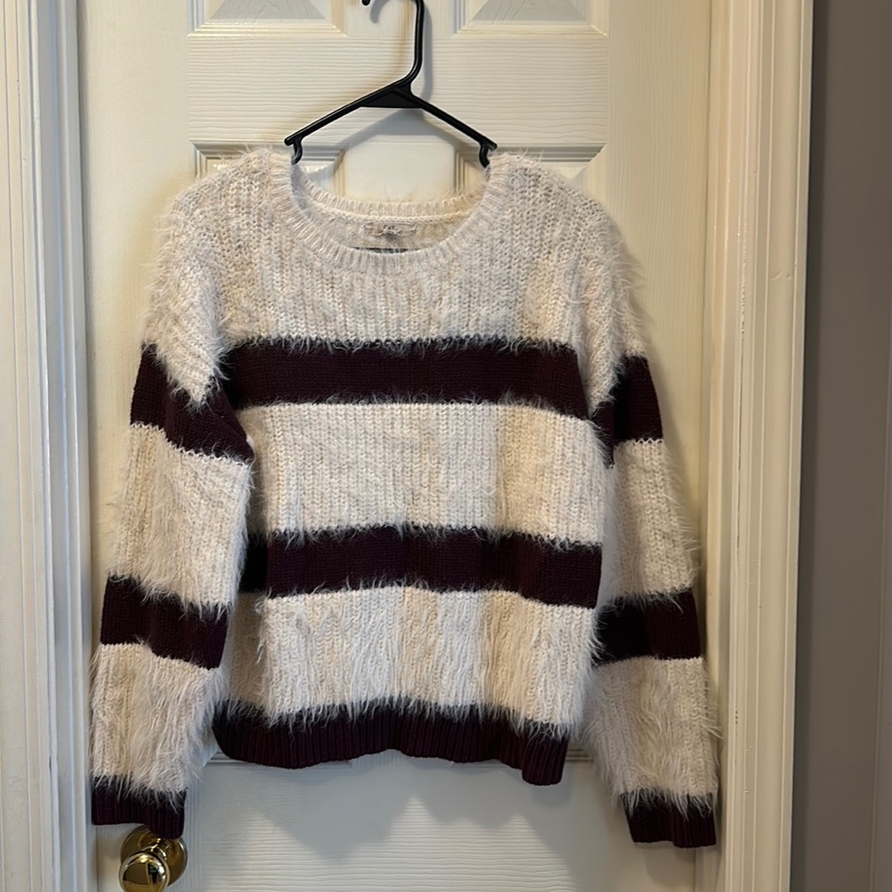 Size XL women’s sweater. Wine/off white stripes. Off white stripes are fuzzy.